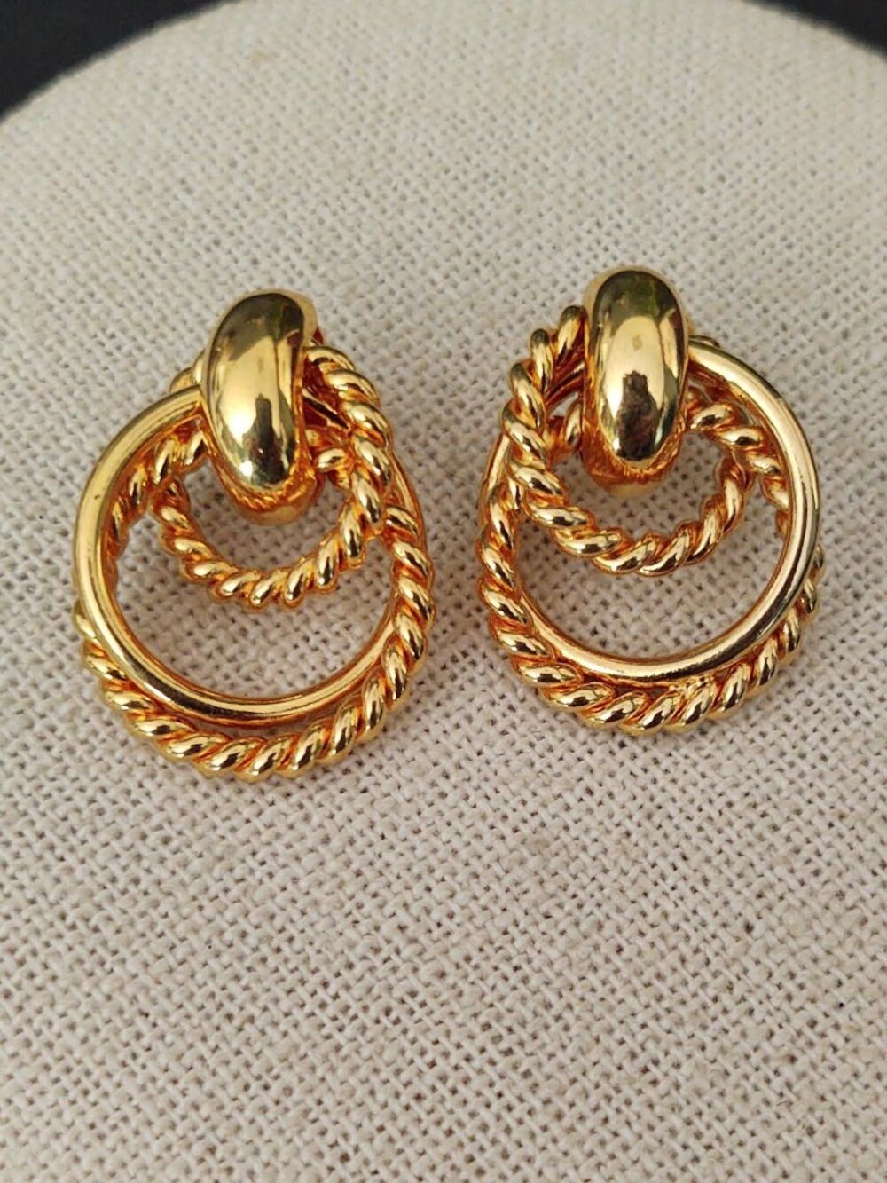 Smooth and textured shiny gold door knocker earrings